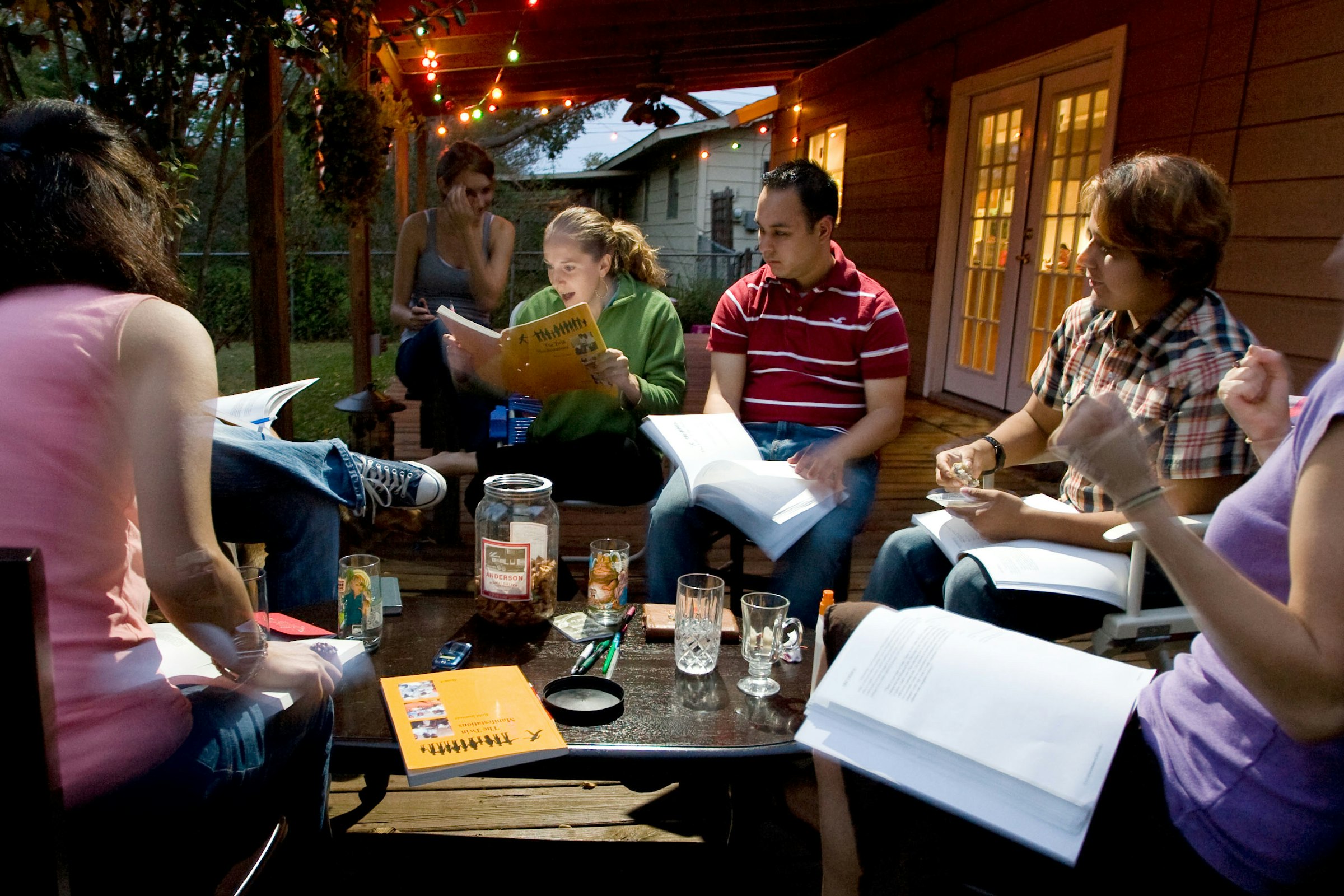 A small group of adults studying together in a Bahá'í study circle.